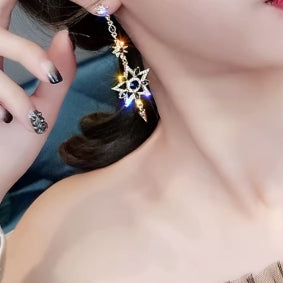Elegant silver color asymmetrical earrings in the shape of a star and moon, long earrings with shiny tassels, personalized jewelry