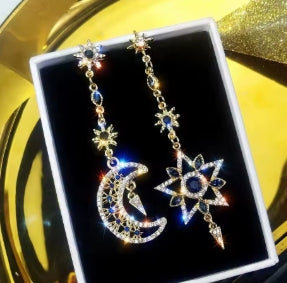 Elegant silver color asymmetrical earrings in the shape of a star and moon, long earrings with shiny tassels, personalized jewelry